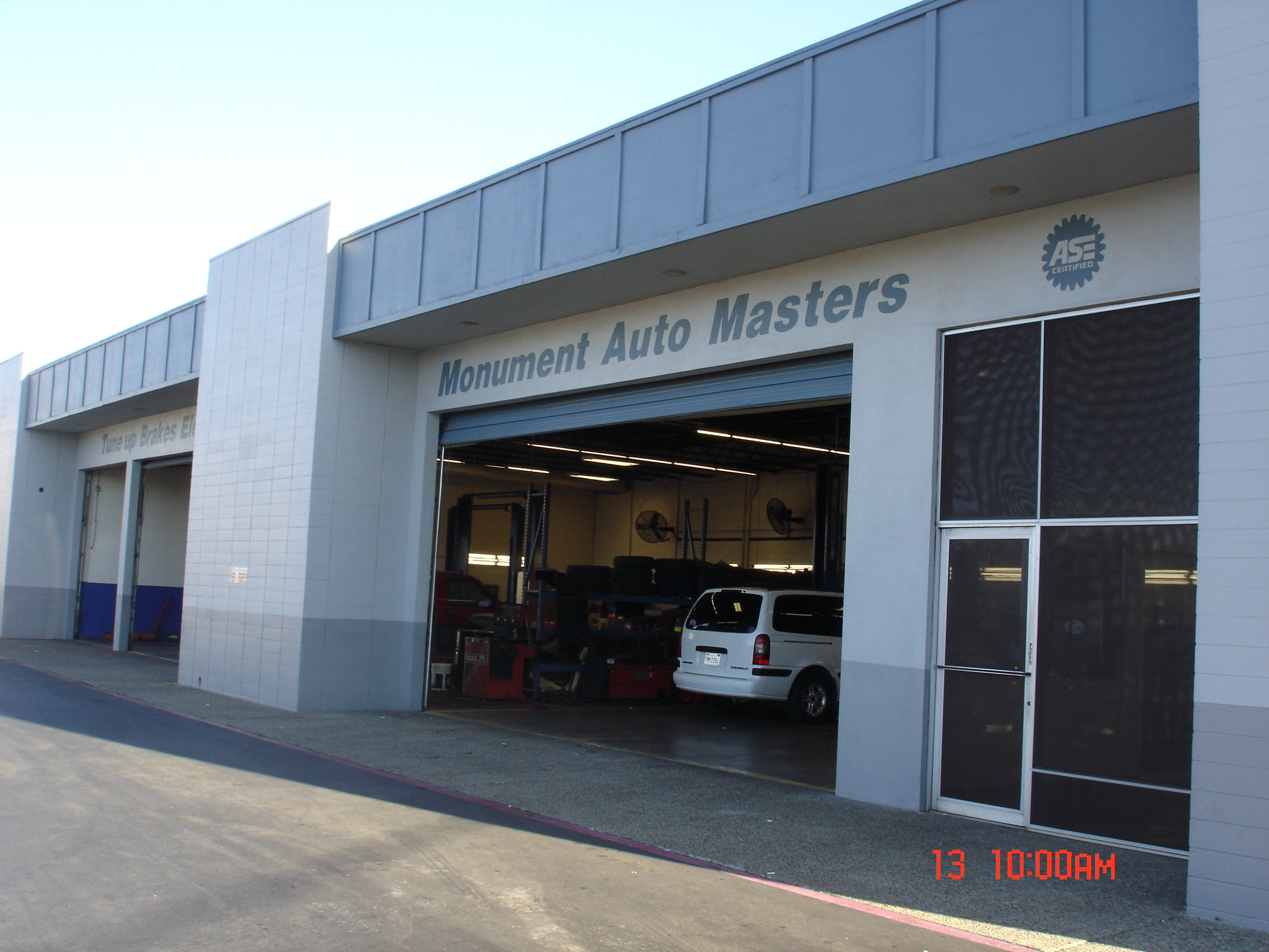 Original photograph of the Monument Auto Masters storefront and open service bay